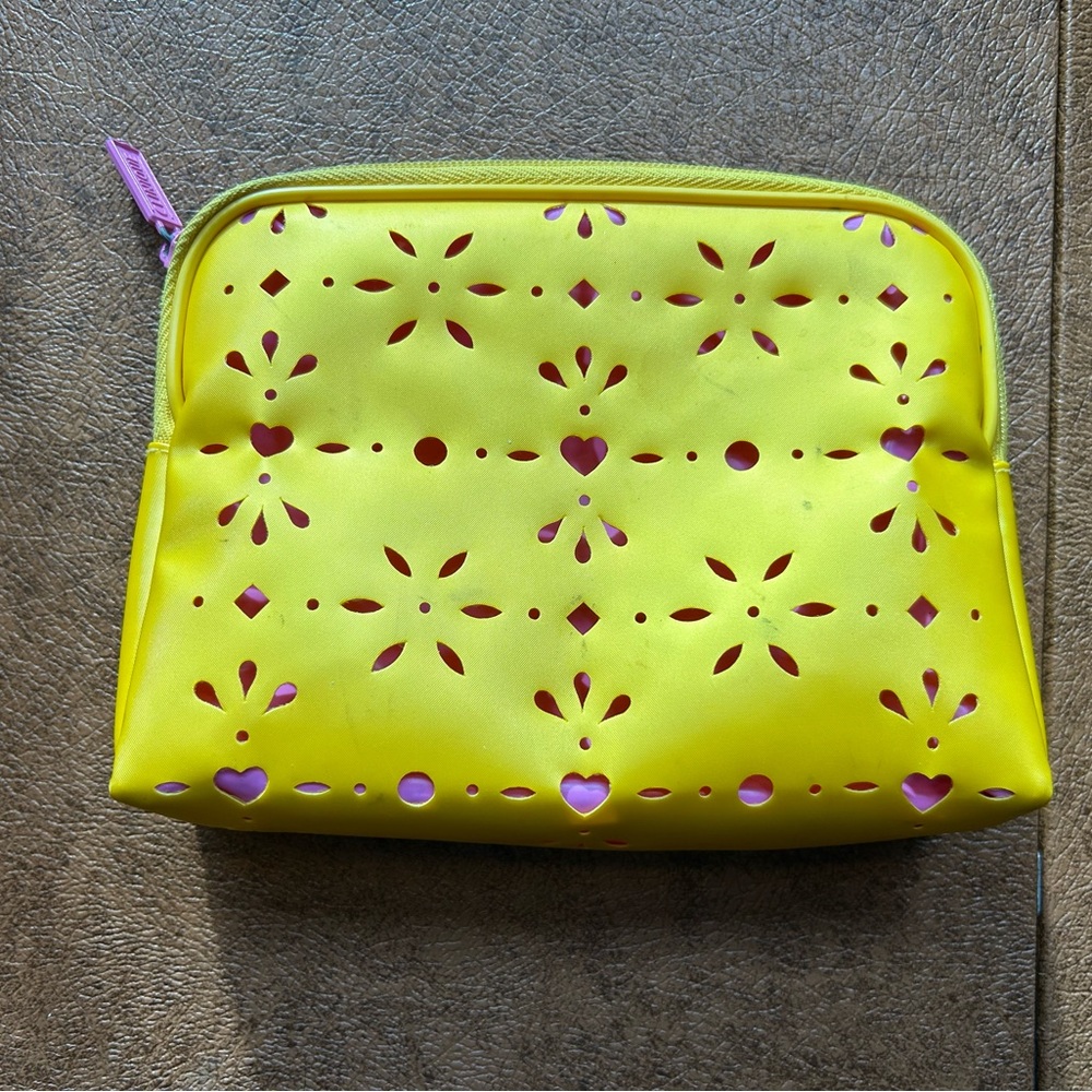 Vibrant Yellow Clutch with Playful Cutouts